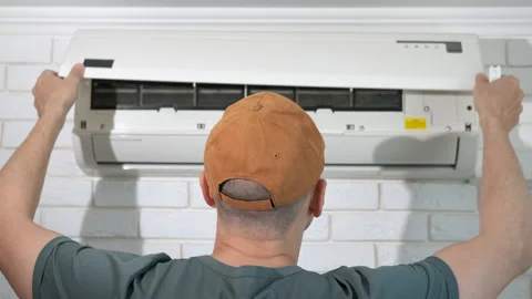 Man press button by broken air conditioner Stock Footage 312468530