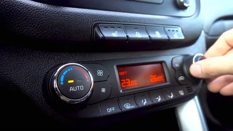 Man press the climate control button and... | Stock Video | Pond5