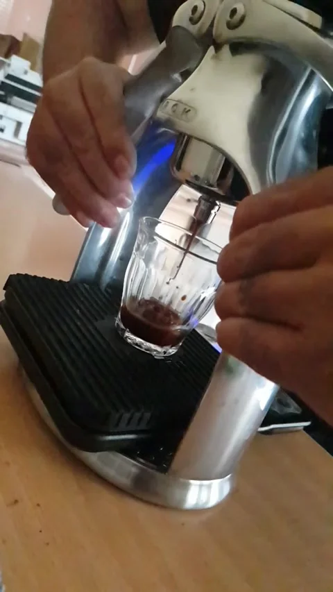A man press the espresso maker. Stock Footage 327255393