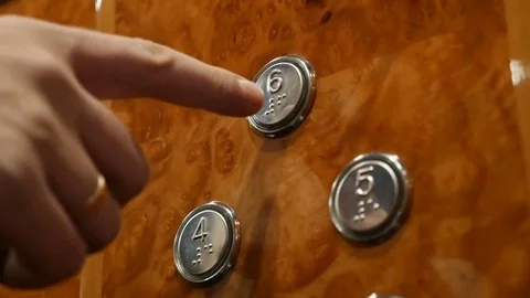 The man presses the button 6 floor in the elevator Stock Footage 83095031