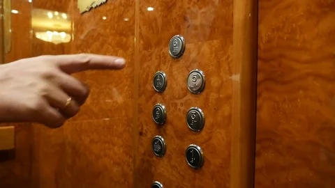 The man presses the button 6 floor in the elevator Stock Footage 83095872