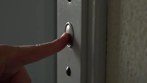 Man presses the button to call the elevator Stock Footage 138931808
