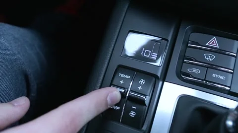 Man presses button on car's dashboard Stock Footage 63146021