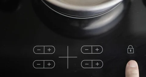 Man Presses A Button On The Electric Stove. A Male hand Includes An Stove Stock Footage 127755768