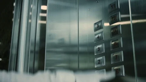 A man presses a button in the Elevator 動画素材 73482496