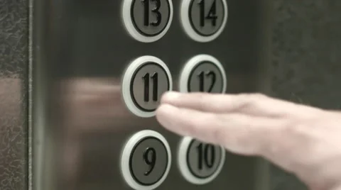 Man presses a button the eleventh floor in an elevator Vidéo 51469013