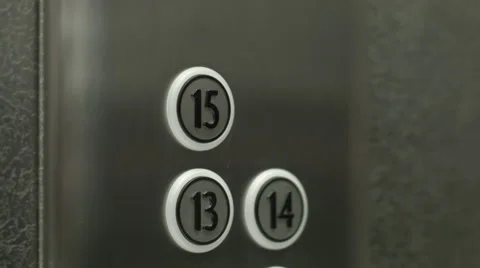 Man presses a button the fifteenth floor in an elevator Vidéo 51468944