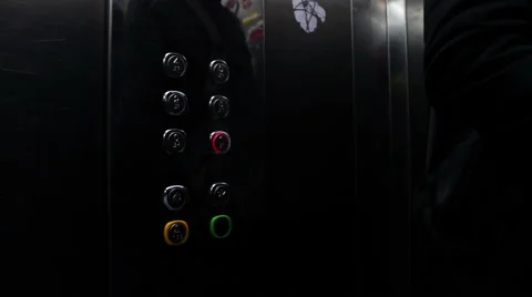 Man presses a button the floor in an elevator Video stock 57229645