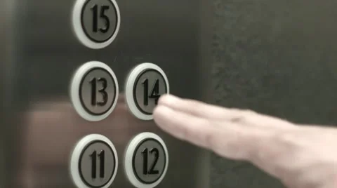 Man presses a button the fourteenth floor in an elevator Vidéo 51468942
