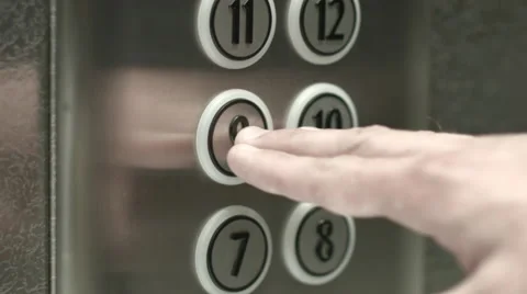 Man presses a button the ninth floor in an elevator Vidéo 51468498