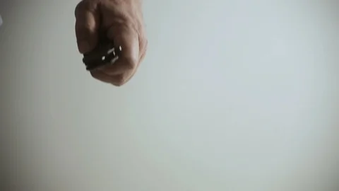 The man presses the button, opens the knife blade and squeezes the knife into a  Stock Footage 100878702