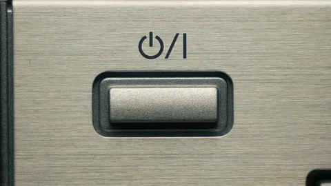 The man presses the on / off button, the power button. Closeup Видео 84479372