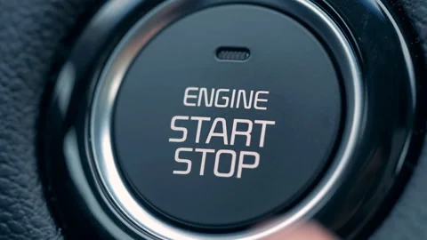A man presses a button to start and stop car engine, close up. Stock Footage 100566471