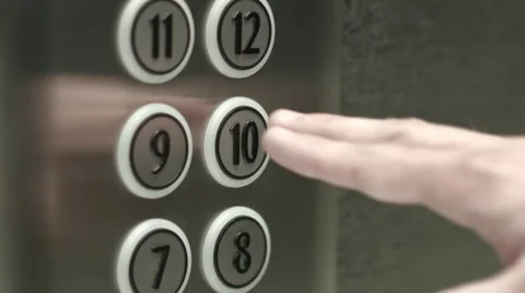 Man presses a button the tenth floor in an elevator Vidéo 51468459