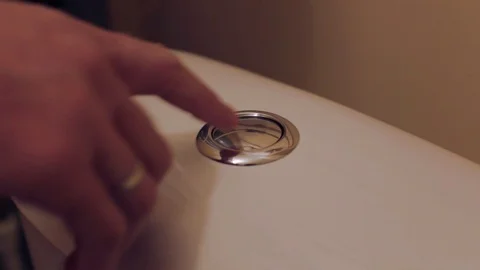  man presses the button on the toilet cistern Video stock 102958225