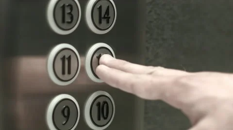 Man presses a button the twelfth floor in an elevator 動画素材 51468891