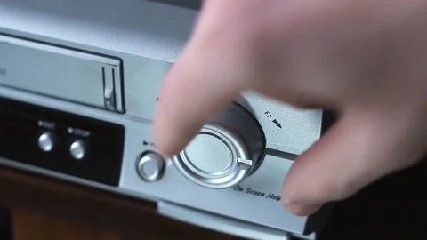 A man presses a button in a video player. Stock Footage 125513874
