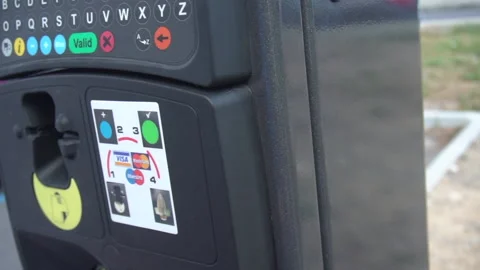 Man presses cancel button on parking meter and points to plus button - Handheld Stock Footage 157287449