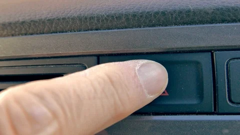 A man presses the car hazard light warning Stock Footage 101793632