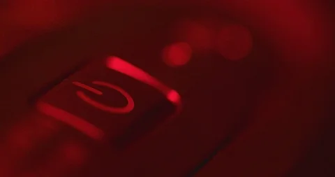 A man presses the computer's power button and the computer starts. then the man Stock Footage 125838058