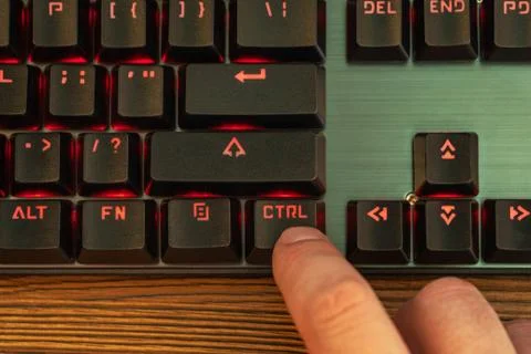 Man presses the control key Stock Photos