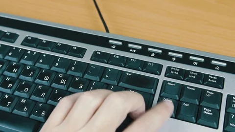 Man presses the Delete key on the computer keyboard. Stock Footage 70559210