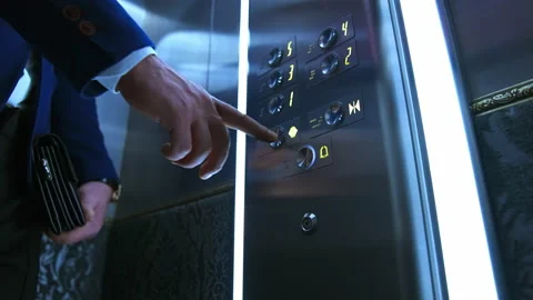 Man presses electronic button in lift. Man's hand touches elevator buttons Video stock 148364086