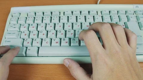 Man presses a hot key on a computer keyboard Stock Footage 70170585