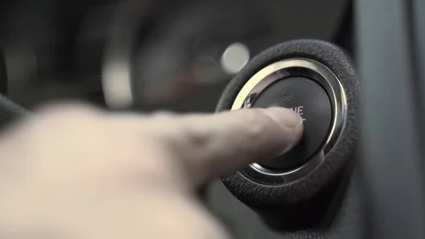 Man presses internal combustion engine start button closeup Stock Footage 116721024