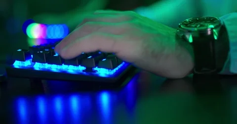 Man presses the keyboard keys with his fingers. Modern backlit keyboard. Close Stock Footage 127012885