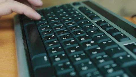 The man presses keys of the computer keyboard Stock Footage 70570828
