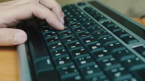 The man presses keys of the computer keyboard Stock Footage 70571506