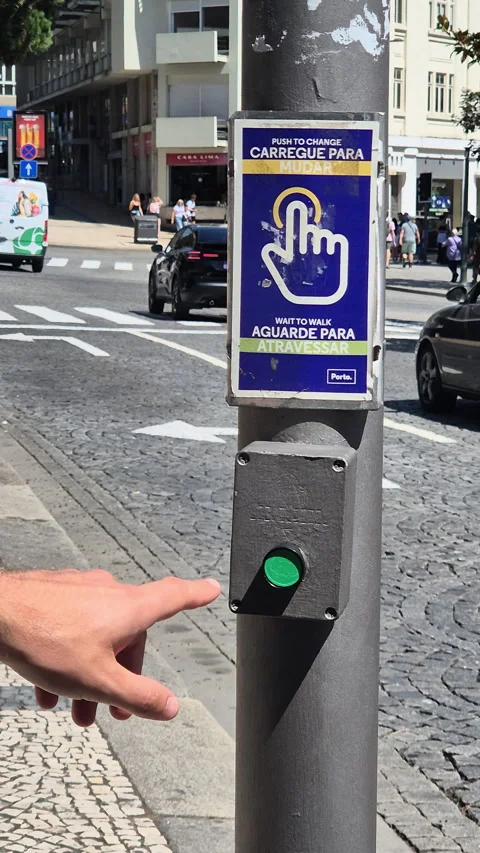 A man presses a pedestrian crossing button on a street. Stock Footage 314471564