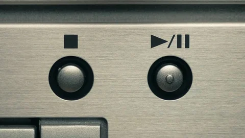 The man presses the play button and the stop button. Closeup Видео 84479351