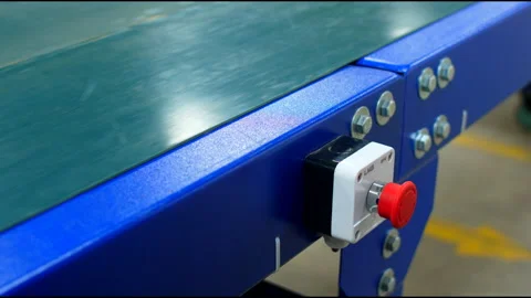 Man presses red button of conveyor belt Stock Footage 231540466