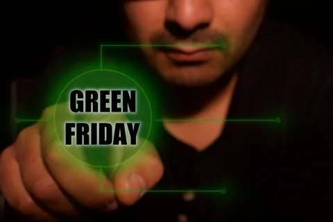 Man presses start button for Green Friday Stock Photos