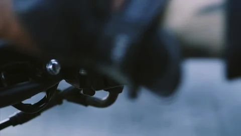 Man presses the start engine button on handlebar motorcycle Stock Footage 115630045