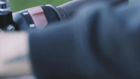 Man presses the start engine button on handlebar motorcycle Stock Footage 115699075