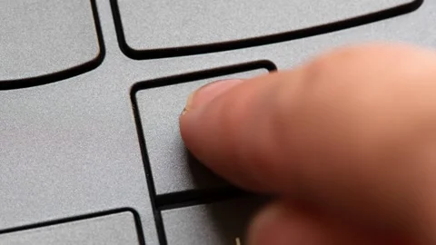 Man pressing the up arrow key on a modern laptop computer keyboard, closeup.. Stock Footage 307614298