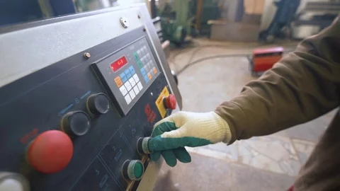 Man pressing a button on a industrial machine Stock Footage 73603155