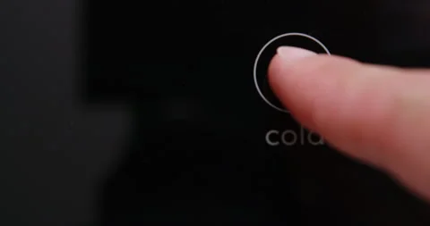 Man pressing button on water filtered machine for cold water dispensing Stock Footage 275489071