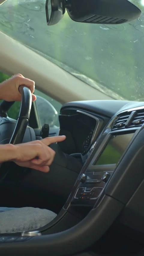 Man pressing car engine start button inside vehicle Stock Footage 312135879