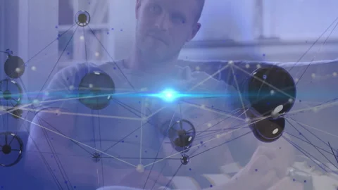 Man pressing controller exploring data with growing virtual node network pulsing Stock Footage 312415505