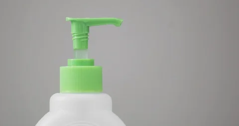 Man pressing on dispensing bottle to clean hands with sanitizer, closeup view. Stock Footage 127705691