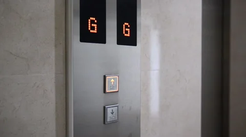 Man pressing down arrow button to go down . Vidéo 52459730