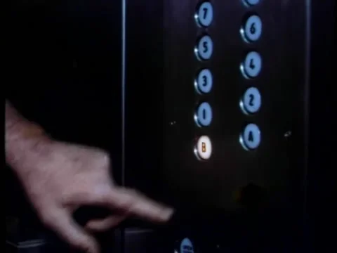 Man pressing elevator button to basement Video stock 260254504