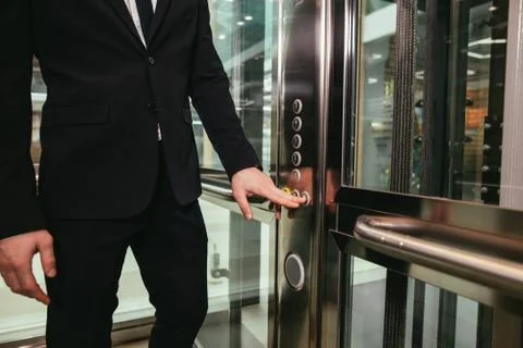 Man pressing elevator button. finger presses elevator button Foto stock