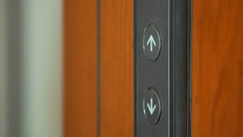 Man pressing elevator button in hotel or modern office building 4K slowmotion Stock Footage 251154720