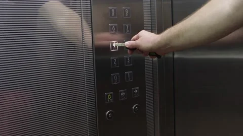 Man is pressing elevator's button with car key for hygienic reasons Video stock 140978400