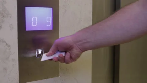 Man is pressing elevator's button with nfc card Stock Footage 140532987